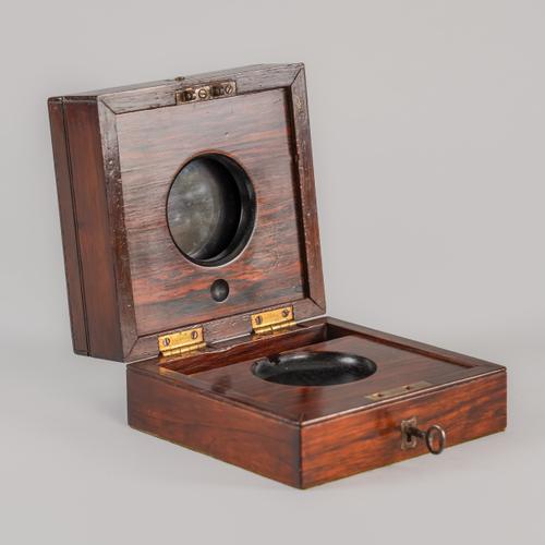 A ROSEWOOD THREE-TIER DECK WATCH CASE