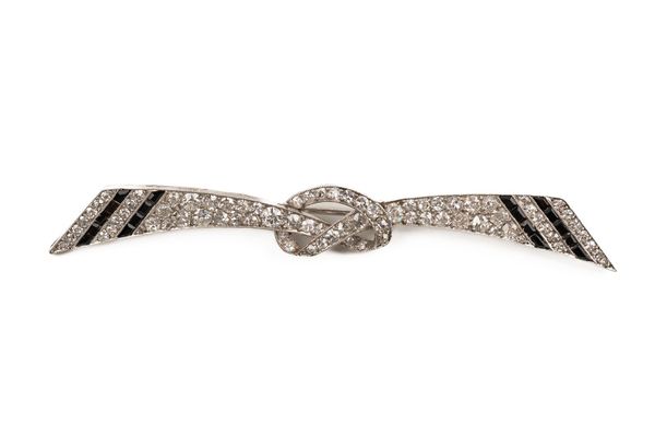 A FRENCH DIAMOND AND BLACK ONYX BROOCH (2)