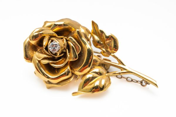 A CARTIER 18CT GOLD AND DIAMOND FLORAL BROOCH (2)