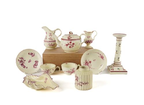 A GROUP OF CREAMWARES WITH PRIMARILY PUCE DECORATION (11)
