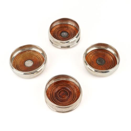 TWO PAIRS OF SILVER MOUNTED CIRCULAR  BOTTLE COASTERS (4)