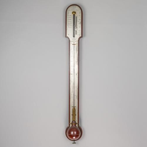 A GEORGE III MAHOGANY STICK BAROMETER