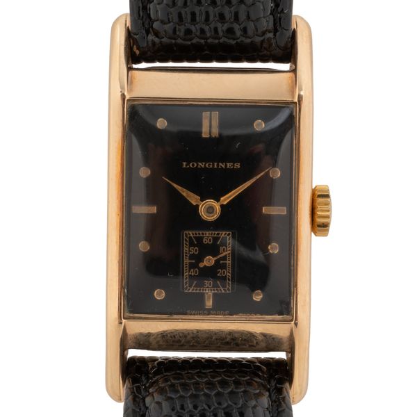 A 1947 LONGINES 14KT GOLD WATCH