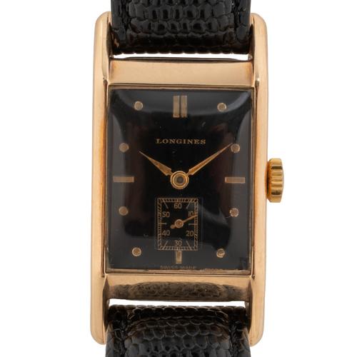 A 1947 LONGINES 14KT GOLD WATCH