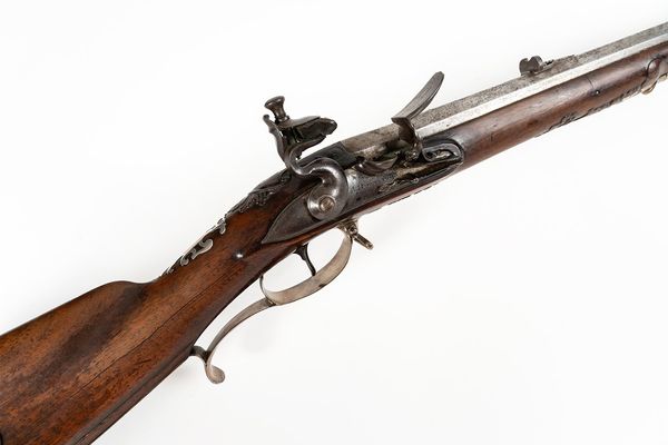 A FLINTLOCK SPORTING RIFLE SIGNED A. HUHNSTOCK