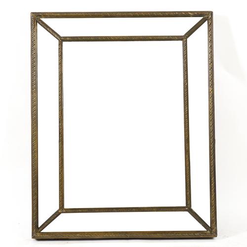 AN EARLY 20TH CENTURY GILT AND BEVELLED GLASS CUSHION FRAMED WALL MIRROR