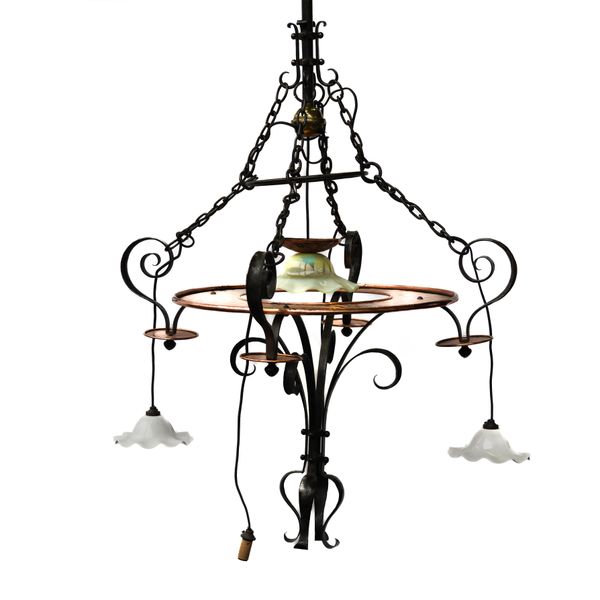IN THE MANNER OF C. R. ASHBEE (1863-1942): AN ARTS AND CRAFTS WROUGHT IRON, COPPER AND GLASS FIVE LIGHT CHANDELIER / ELECTROLIER
