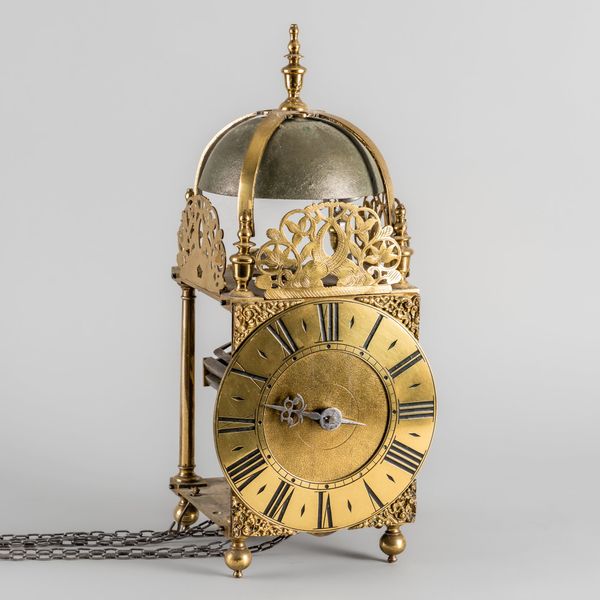 AN ANTIQUE BRASS LANTERN CLOCK