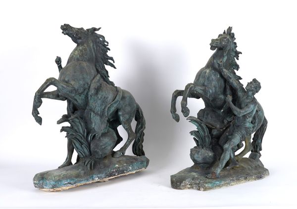 AFTER GUILLAUME COUSTOU THE ELDER (1677-1746): A PAIR OF PATINATED BRONZE MODELS OF THE MARLY HORSES (2)
