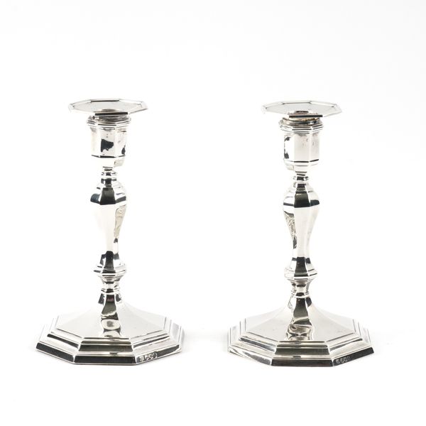 TWO SIMILAR SILVER CANDLESTICKS (2)