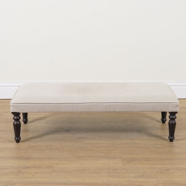 A GREY UPHOLSTERED RECTANGULAR FOOTSTOOL