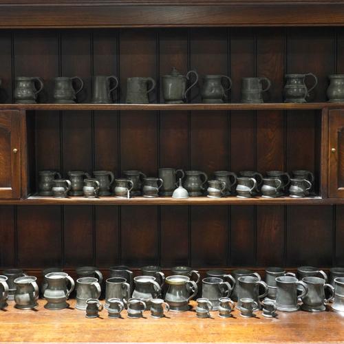 A GROUP OF PEWTER HALF PINT, GILL, HALF GILL AND QUARTER GILL MEASURE TANKARDS (65)