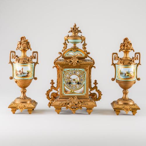 A FRENCH GILT SPELTER PORCELAIN-MOUNTED GARNITURE