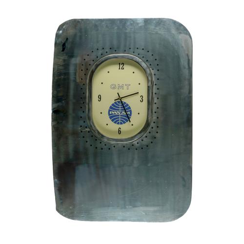 A POLISHED METAL ALLOY AIRCRAFT FUSELAGE AND WINDOW ‘PAN AM’ WALL CLOCK