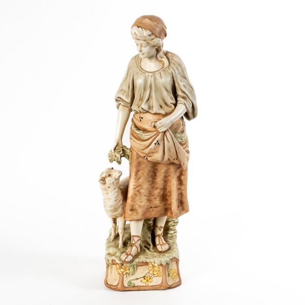 ROYAL DUX STYLE; A FIGURE GROUP OF A SHEPHERDESS WITH SHEEP