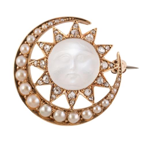 A MOON AND SUN BROOCH