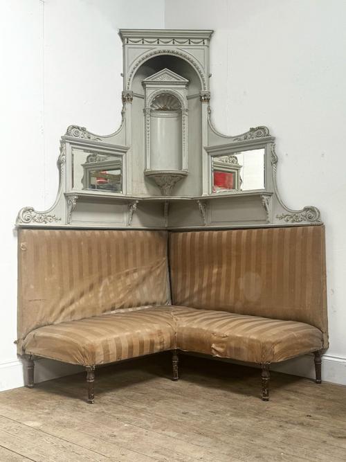 A VICTORIAN MIRRORED SHELF BACK CORNER SOFA