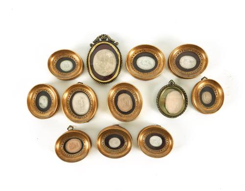 A COLLECTION OF FRAMED PLASTER INTAGLIOS (12)