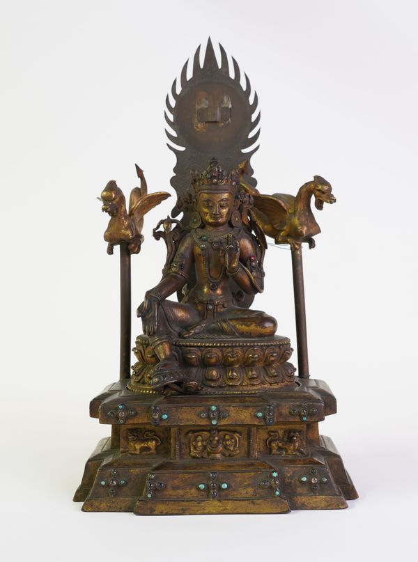 A SINO-TIBETAN GILT-BRONZE FIGURE OF TARA AND STAND (2)