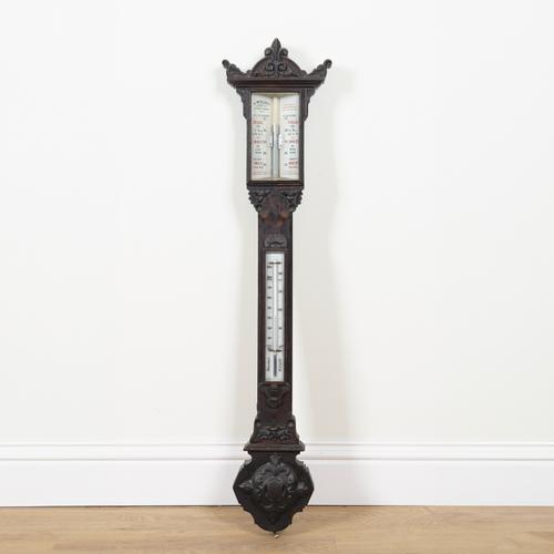 A VICTORIAN CARVED AND STAINED OAK STICK BAROMETER/THERMOMETER