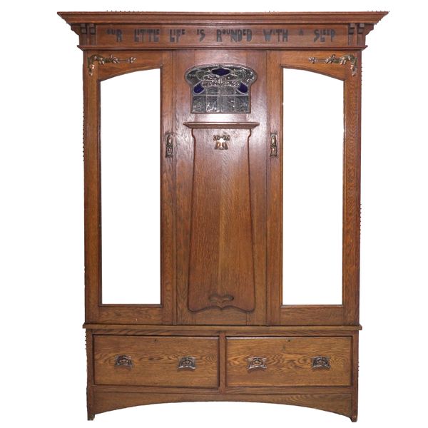 AN ARTS AND CRAFTS OAK DOUBLE WARDROBE