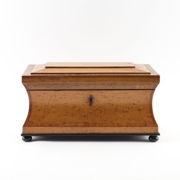 A WILLIAM IV BIRDSEYE MAPLE SARCOPHAGUS FORM TEA CADDY