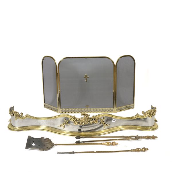 A ROCOCO REVIVAL LACQUERED BRASS AND STEEL SERPENTINE FENDER (5)