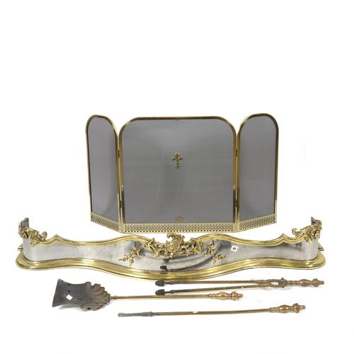 A ROCOCO REVIVAL LACQUERED BRASS AND STEEL SERPENTINE FENDER (5)