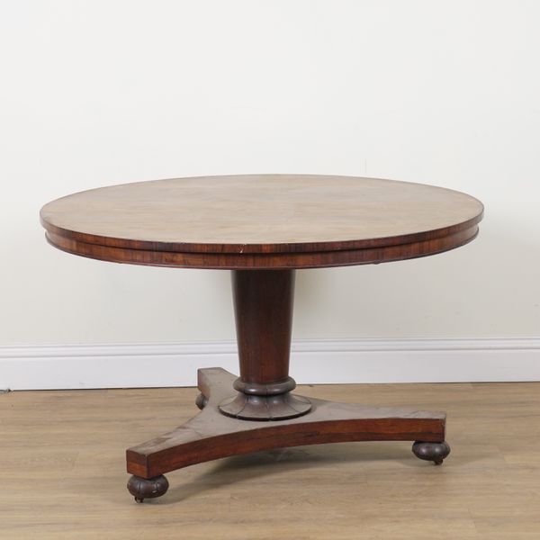 A REGENCY ROSEWOOD CIRCULAR SNAP TOP CENTRE TABLE