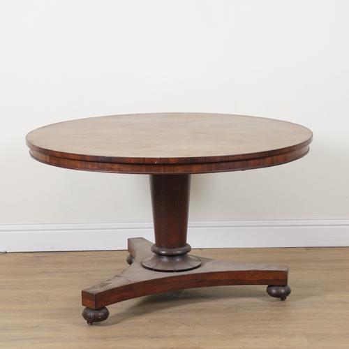 A REGENCY ROSEWOOD CIRCULAR SNAP TOP CENTRE TABLE
