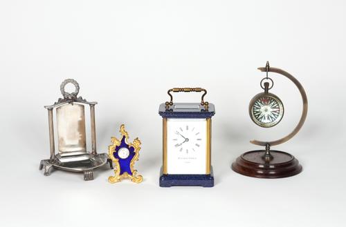 MATTHEW NORMAN: A BLUE ENAMELLED CARRIAGE CLOCK, WITH TWO FURTHER CLOCKS AND A POCKET WATCH STAND (4)