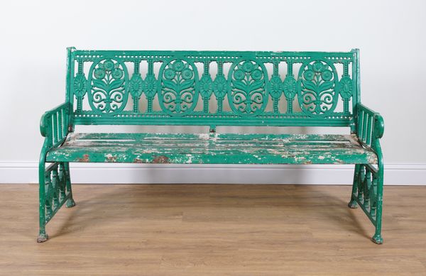 IN THE MANNER OF COALBROOKDALE; A MID 20TH CENTURY SUN FLOWER PATTERN GREEN PAINTED CAST IRON GARDEN BENCH