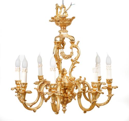 AN ITALIAN ROCOCO STYLE GILT-METAL EIGHT LIGHT CHANDELIER