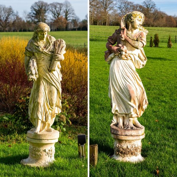 A PAIR OF RECONSTITUTED STONE FIGURES MODELLED AS A FEMALE WHEAT GATHERER AND FEMALE WOOD GATHERER (2)