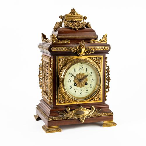 A FRENCH GILTMETAL-MOUNTED MAHOGANY MANTEL CLOCK