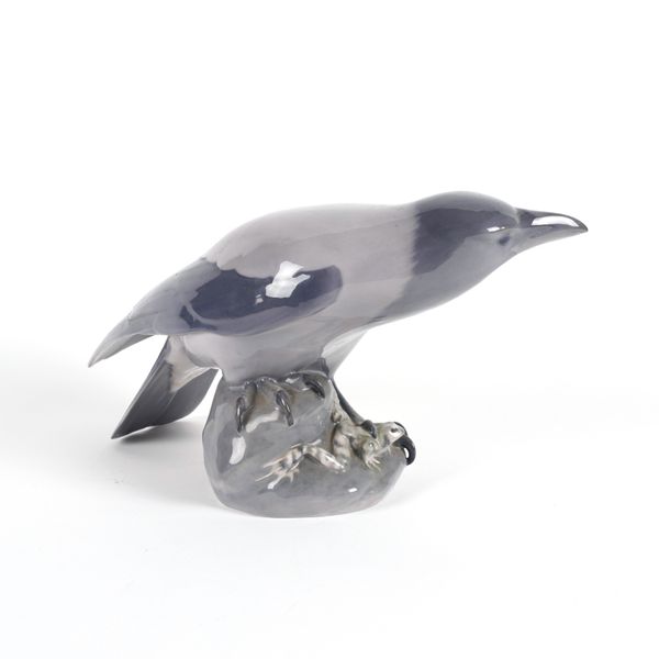 A LARGE ROYAL COPENHAGEN `CROW WITH FROG'