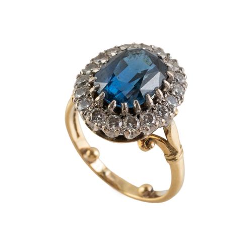 A SAPPHIRE AND DIAMOND CLUSTER RING