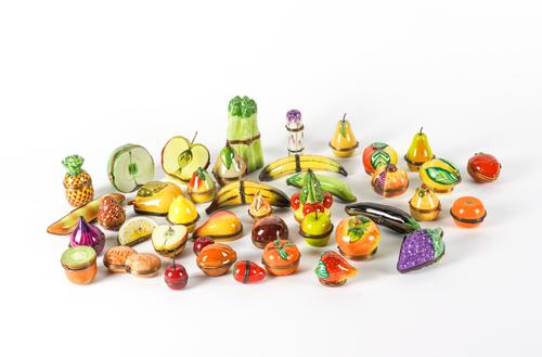 MOSTLY LIMOGES: A COLLECTION OF ENAMEL GILT-METAL MOUNTED BOXES AND PILL BOXES MODELLED NATURALISTICALLY AS VARIOUS FRUITS AND VEGETABLES  (41)