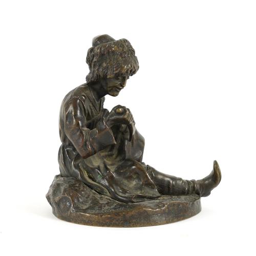 VASSILI YACOVLEVITCH GRACHEV, RUSSIAN (1831-1905): A BRONZE FIGURE OF A SEATED COSSACK
