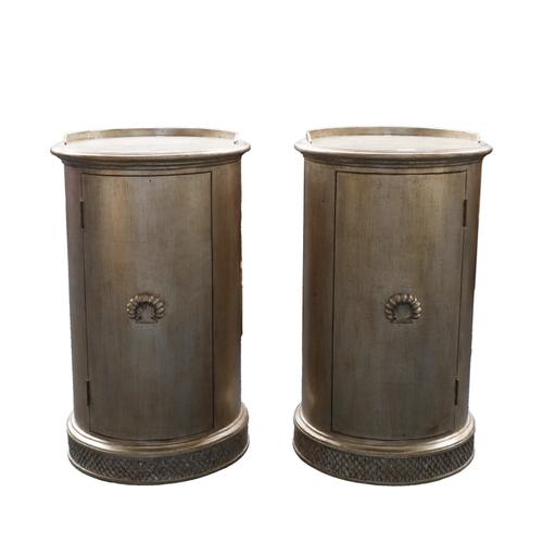 AND SO TO BED; A PAIR OF SILVER PAINTED CYLINDRICAL BEDSIDE CUPBOARDS (2)