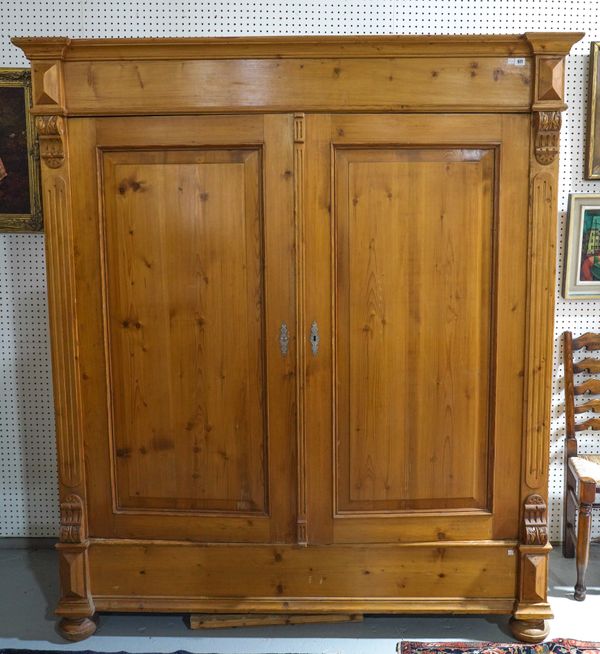 A 19TH CENTURY FRENCH PINE TWO DOOR ARMOIRE