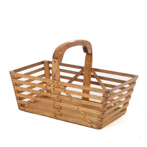 AN EARLY 20TH CENTURY SLATTED OAK BASKET