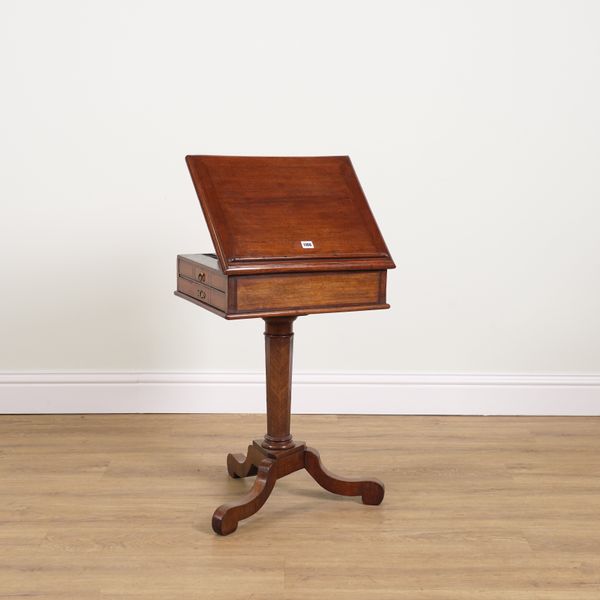 A GEORGE III FEATHER BANDED MAHOGANY ANGLE ADJUSTABLE TWO DRAWER WRITING TABLE