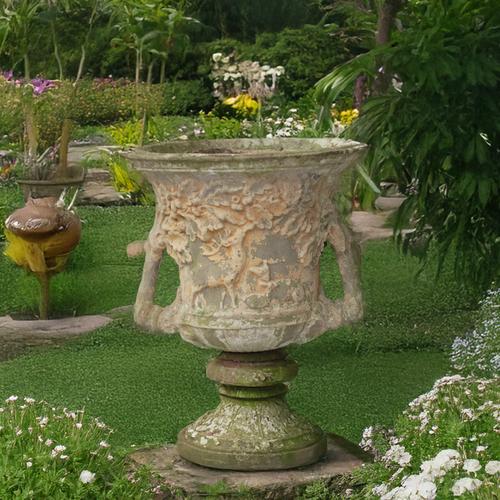 A RECONSTITUTED STONE TWIN HANDLE JARDINIERE