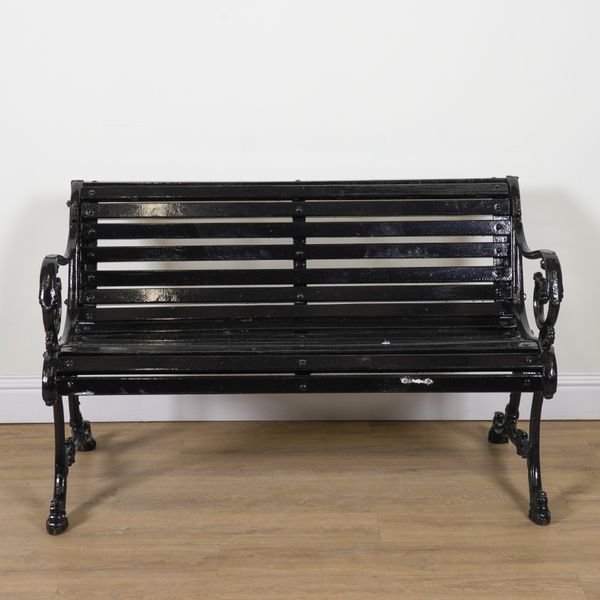 A VICTORIAN BLACK PAINTED CAST IRON GARDEN BENCH