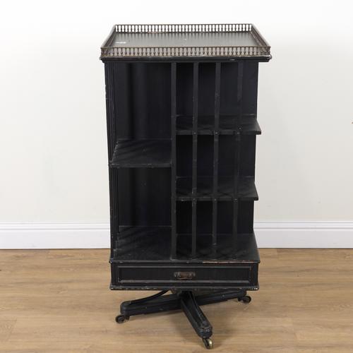 GILLOWS & CO LANCASTER; AN AESTHETIC MOVEMENT LATER EBONISED REVOLVING BOOKCASE