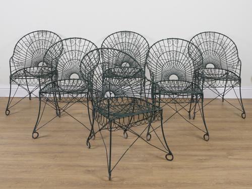 A SET OF SIX EARLY 20TH CENTURY GREEN PAINTED WIREWORK GARDEN CHAIRS (6)
