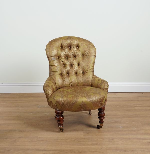 A 19TH CENTURY FLORAL PATTERNED, GOLD UPHOLSTERED BUTTON BACK EASY ARMCHAIR