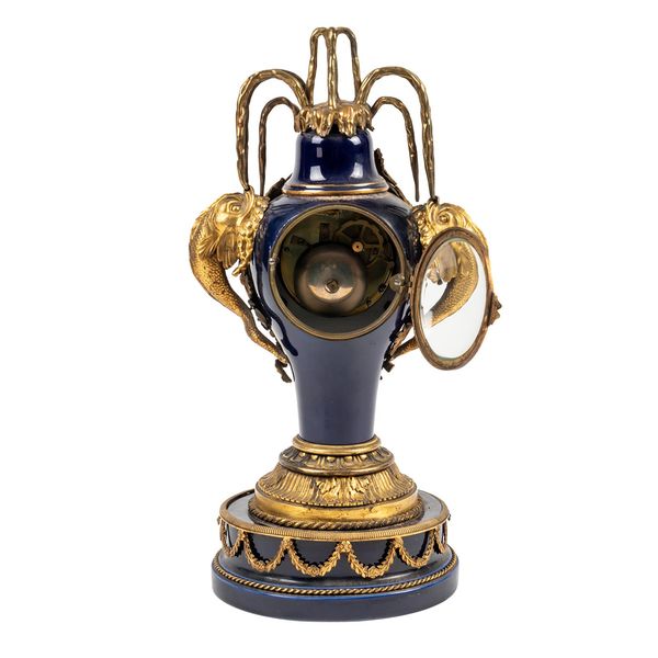 A FRENCH ORMOLU AND BLUE SEVRES-STYLE PORCELAIN MANTEL CLOCK