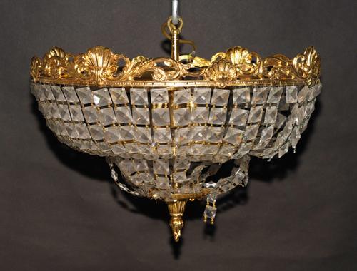 A PAIR OF GILT-METAL AND GLASS HUNG FOUR LIGHT PLAFONNIERS OR CEILING LIGHTS (2)